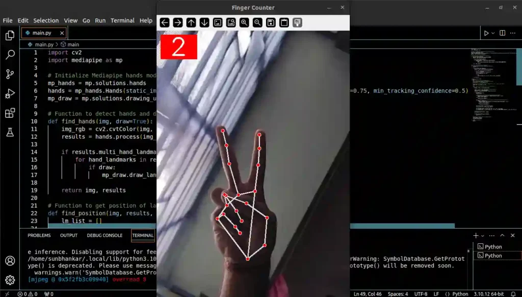 Screenshot of a code editor with a hand showing two fingers, the number 2 displayed at the top corner